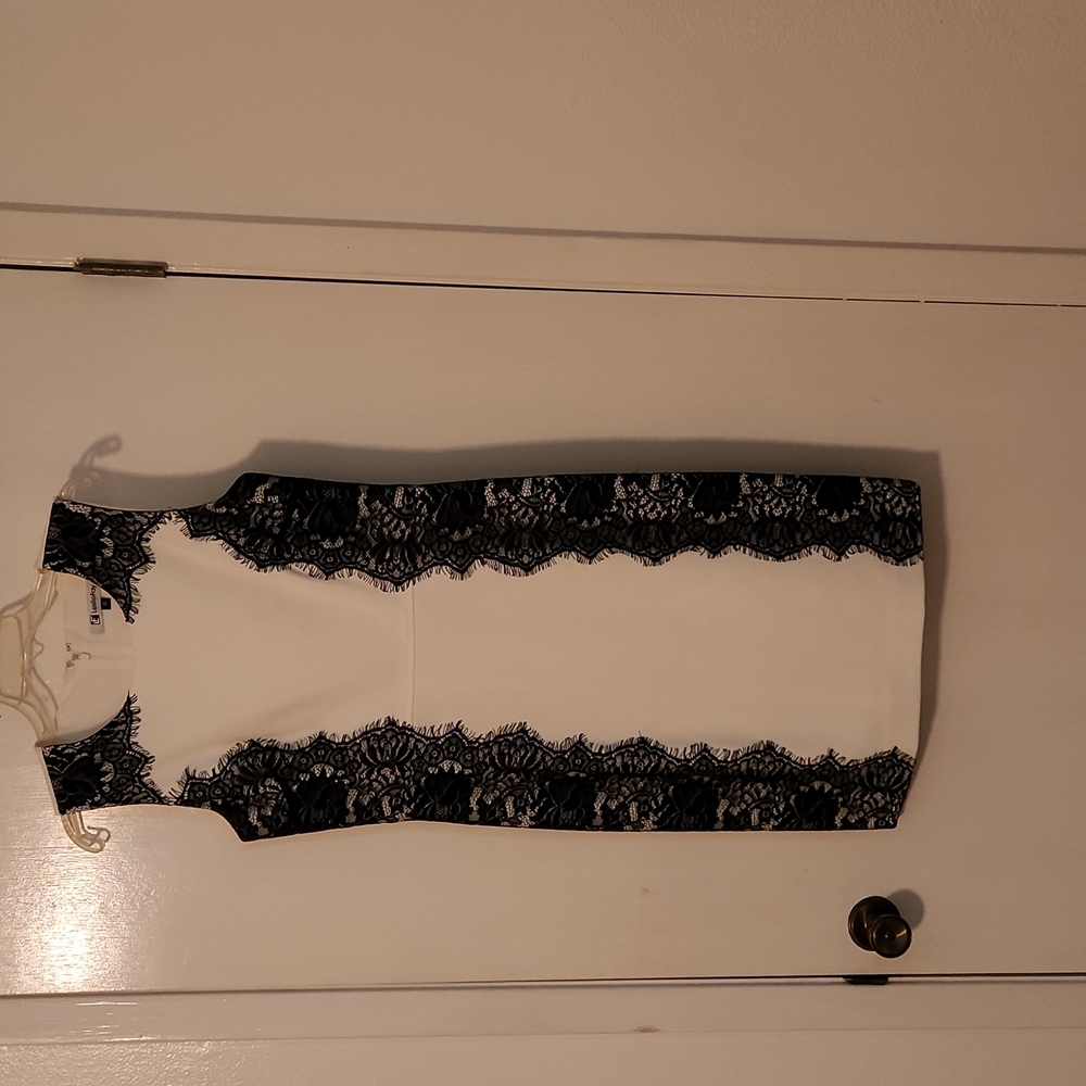 Beautiful Black and White Dress with black lace on the sides!